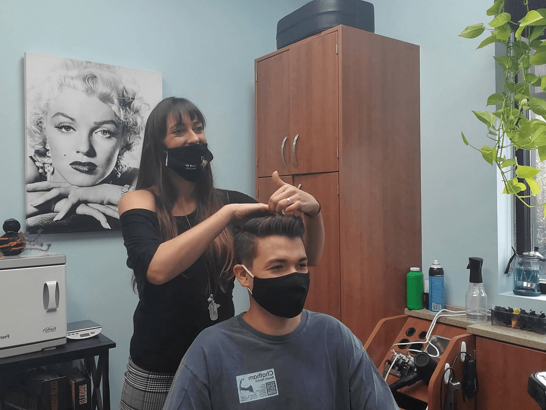 Rachel styling a client's hair at Hair by Rachel salon