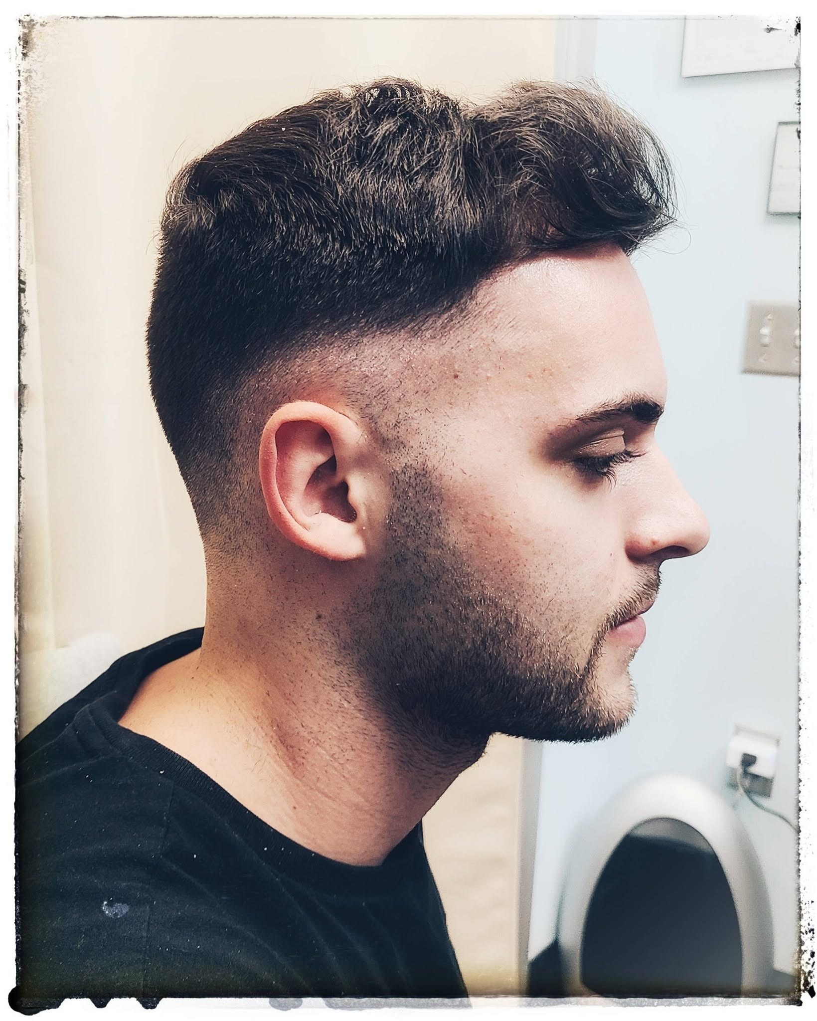 Professional men's fade haircut by Rachel