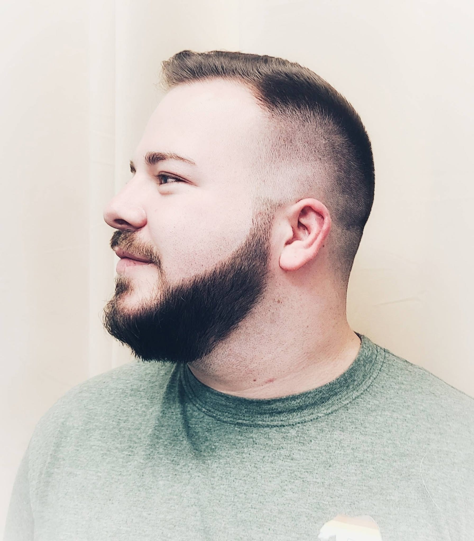 Clean fade haircut with beard styling by Rachel