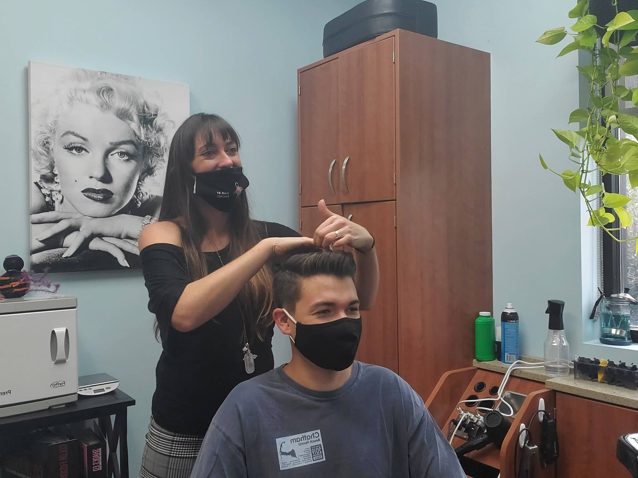 Rachel styling a client's hair at Hair by Rachel salon